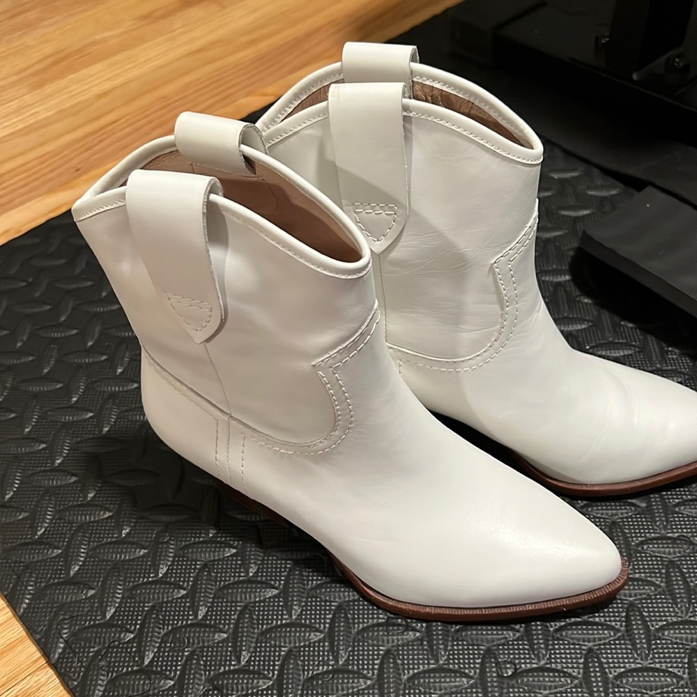 Very stylish Boots! Never worn brand new and ready to make any outfit pop!